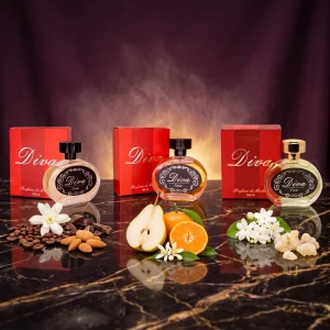 Kit Promocional Diva com os perfumes Diva One, Diva Four e Diva Five e suas caixas, com café, amêndoas, pera, tangerina e jasmim sobre mármore